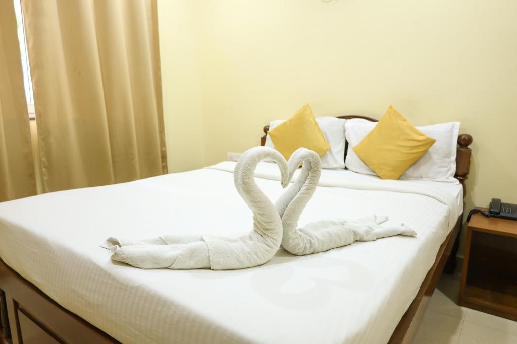 Freshly made bed with towel swans at Hotel Baga Grande